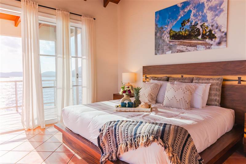 Master king suite with ocean view and designer linens at Ocean Pointe Caribe, St Thomas USVI