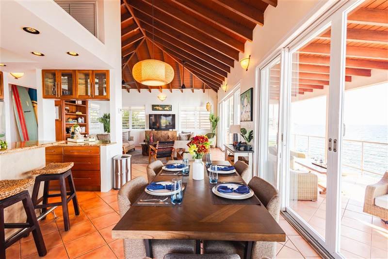 Formal dining room seating twelve guests at Ocean Pointe Caribe luxury villa, St Thomas