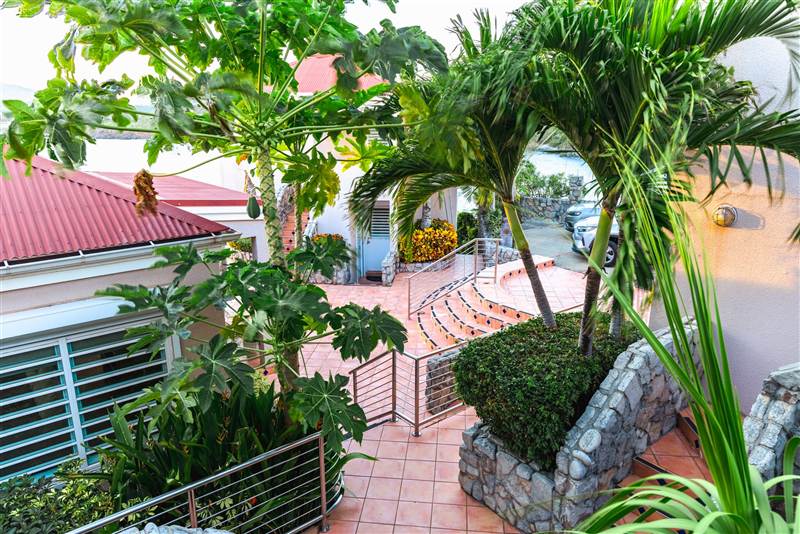 Grand entrance and manicured grounds of Ocean Pointe Caribe luxury estate, St Thomas USVI