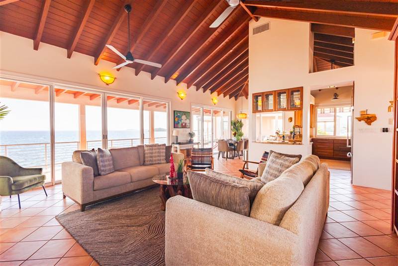 Elegant open-concept living room with designer furnishings at Ocean Pointe Caribe luxury villa
