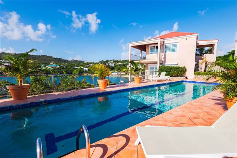 Infinity pool overlooking the Caribbean Sea at Ocean Pointe Caribe luxury estate, St Thomas USVI