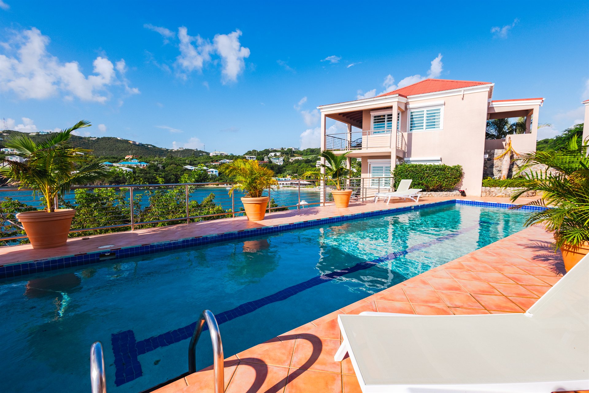 Infinity pool overlooking the Caribbean Sea at Ocean Pointe Caribe luxury estate, St Thomas USVI